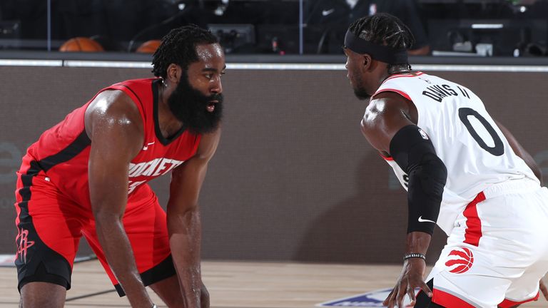 James Harden is guarded by Terence Davis