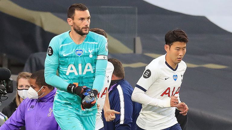 Tottenham Hotspur&#39;s French goalkeeper Hugo Lloris (L) and Tottenham Hotspur&#39;s South Korean striker Son Heung-Min arrive on the pitch for the second half during the English Premier League football match between Tottenham Hotspur and Everton at Tottenham Hotspur Stadium in London, on July 6, 2020