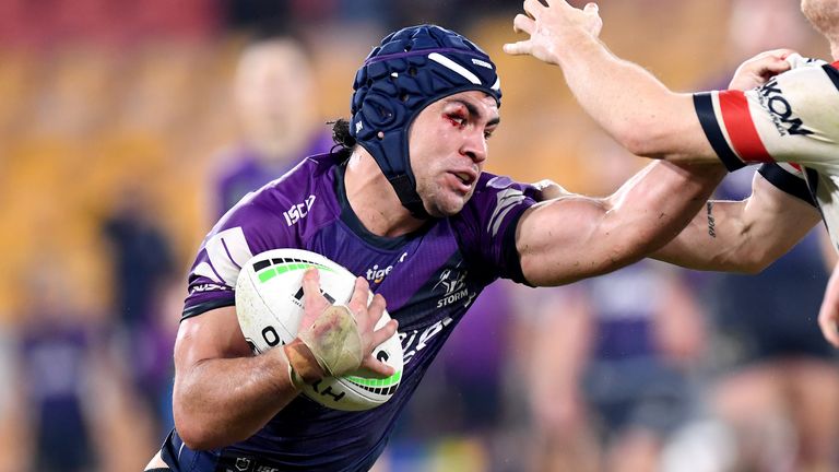 BRISBANE, AUSTRALIA - JULY 02: Jahrome Hughes of the Storm attempts to break away from the defence of Luke Keary of the Roosters during the round eight NRL match between the Melbourne Storm and the Sydney Roosters at Suncorp Stadium on July 02, 2020 in Brisbane, Australia. (Photo by Bradley Kanaris/Getty Images)