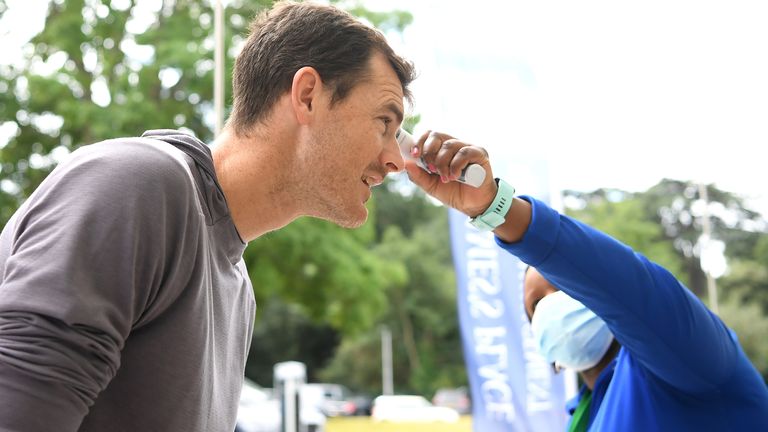 Jamie Murray has his temperature checked on arrival at National Tennis Centre on July 27, 2020 in London, England