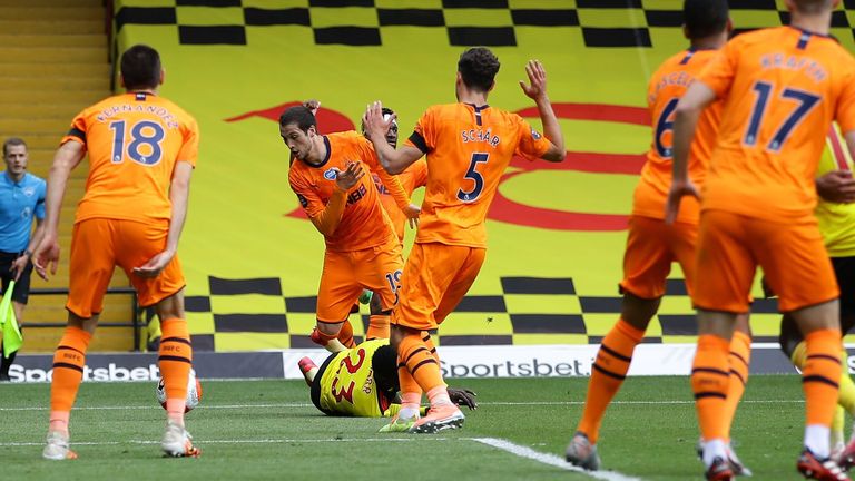 Javier Manquillo brings down Ismaila Sarr inside the box to concede a penalty