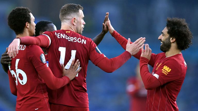 Jordan Henderson of Liverpool celebrates with his team after scoring his sides second goal during the Premier League match between Brighton & Hove Albion and Liverpool 