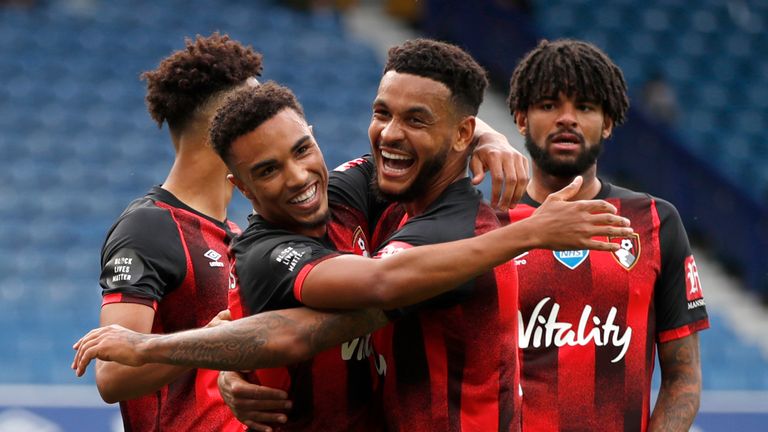 Joshua King celebrates after Bournemouth extended their lead on Merseyside
