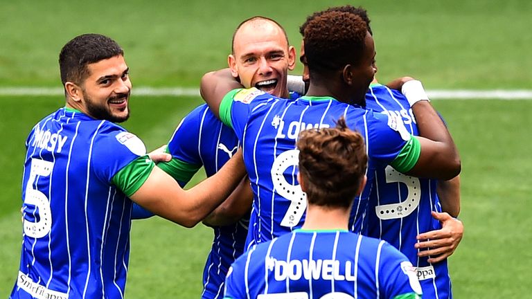 Kal Naismith celebrates scoring for Wigan against Hull