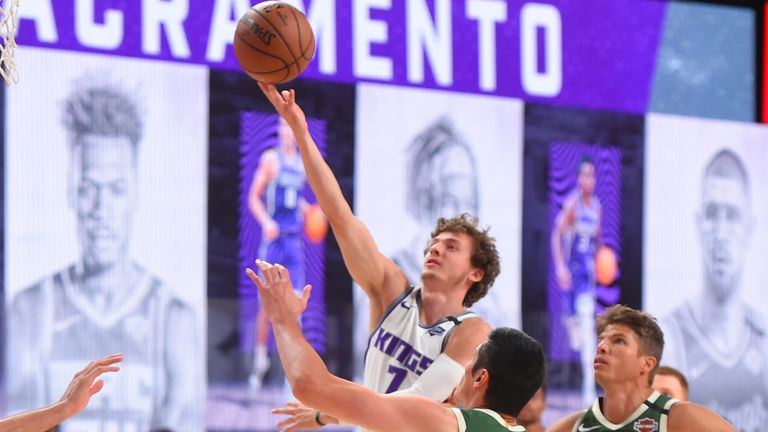 Kyle Guy of the Sacramento Kings shoots the ball against the Milwaukee Bucks