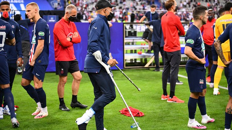 Kylian Mbappe joined his teammates on crutches following their French Cup final triumph