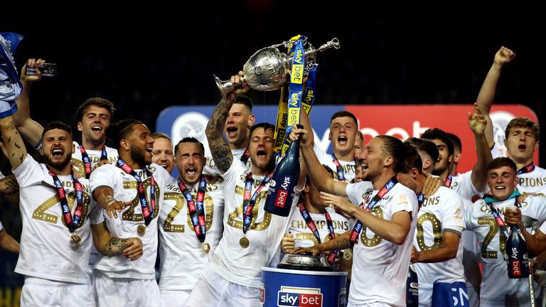 Leeds United&#39;s Liam Cooper lifts the Sky Bet Championship trophy