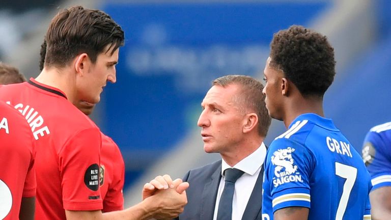 Leicester City boss Brendan Rodgers shakes hands with Manchester United's Harry Maguire after their 2-0 home defeat on the final day of the 2019/20 season