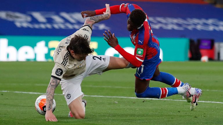 Victor Lindelof challenges Wilfried Zaha