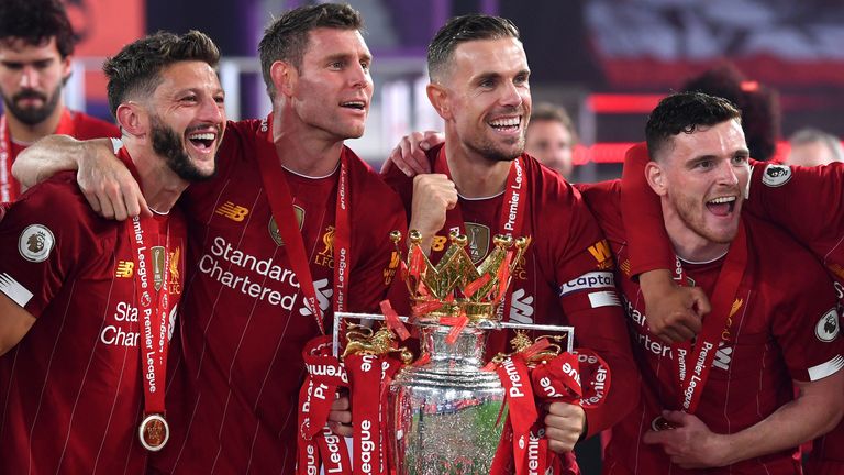 Liverpool celebrate with the Premier League trophy