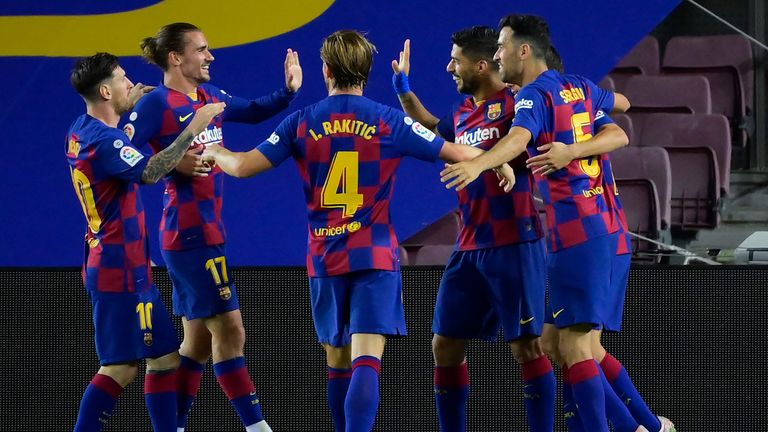 Luis Suarez celebrates with his teammates 