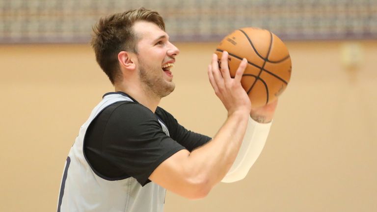 Luka Doncic launches a shot during the Dallas Mavericks&#39; first practice inside the Orlando bubble