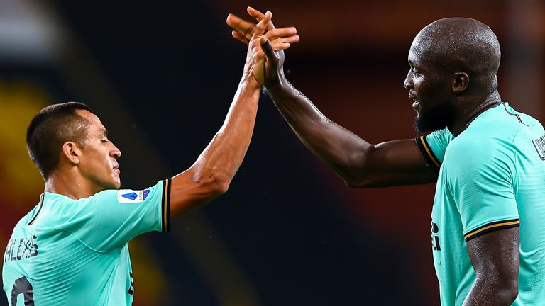 Romelu Lukaku of Inter (right) celebrates with his team-mate Alexis Sanchez after scoring his second goal during the Serie A match between Genoa CFC and FC Internazionale at Stadio Luigi Ferraris on July 25, 2020 in Genoa, Italy. 