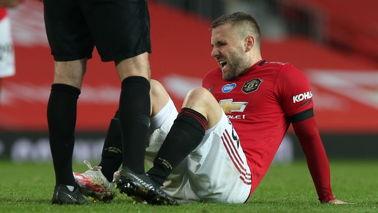 Luke Shaw winces after rolling his right ankle against Southampton