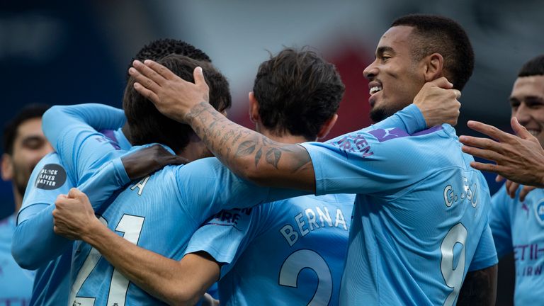 MANCHESTER, ENGLAND - JULY 15: Goalscorer David Silva of Manchester City is congratulated by team mates including Gabriel Jesus during the Premier League match between Manchester City and AFC Bournemouth  at Etihad Stadium on July 15, 2020 in Manchester, United Kingdom. (Photo by Visionhaus) *** Local Caption *** David Silva; Gabriel Jesus