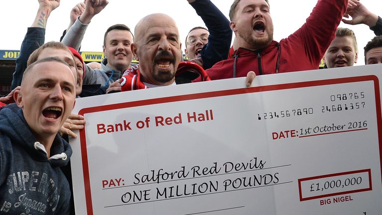 Marwan Koukash celebrates with the fans after Salford's victory