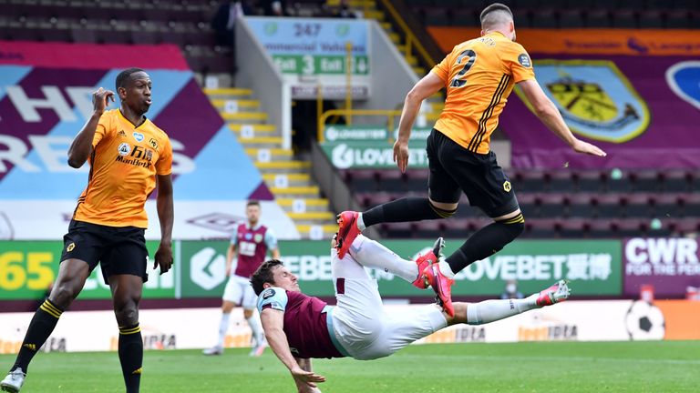 Wolves' Matt Doherty is penalised for handball after rising with Chris Wood