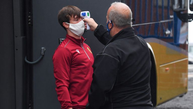 Motherwell's Chris Long has his temperature check after arriving at Ibrox for the pre-season friendly against Rangers
