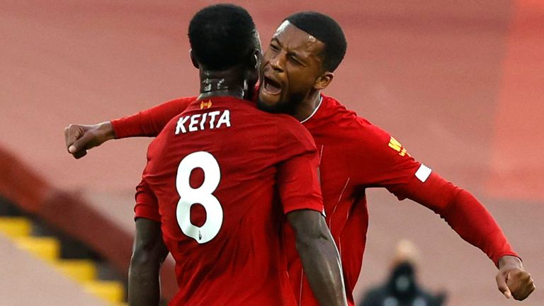 Naby Keita celebrates with Georginio Wijnaldum after putting Liverpool ahead against Chelsea