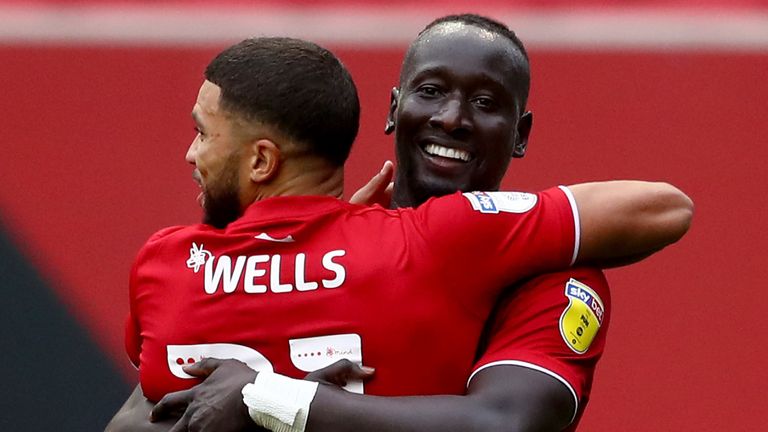 Famara Diedhiou celebrates with Nahki Wells after opening the scoring at Ashton Gate