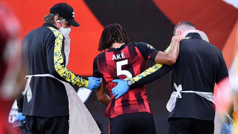Nathan Ake goes off injured during Bournemouth's match against Leicester