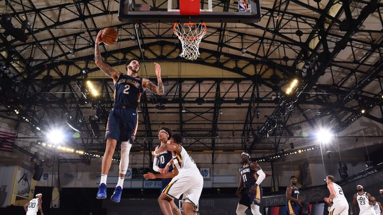  Lonzo Ball #2 of the New Orleans Pelicans grabs the rebound during the game against the Utah Jazz during a game on July 30, 2020 at The HP Field House at ESPN Wide World Of Sports Complex in Orlando, Florida. 