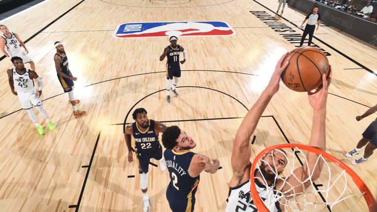 Rudy Gobert #27 of the Utah Jazz dunks the ball during the game against the New Orleans Pelicans during a game on July 30, 2020 at The HP Field House at ESPN Wide World Of Sports Complex in Orlando, Florida. 