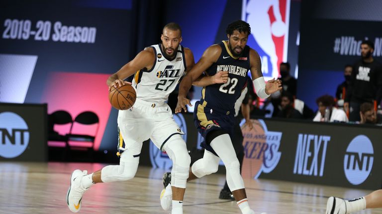 Rudy Gobert #27 of the Utah Jazz handles the ball against the New Orleans Pelicans on July 30, 2020 at HP Field House at ESPN Wide World of Sports in Orlando, Florida. 