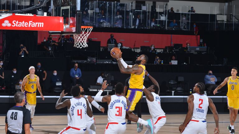 LeBron James #23 of the Los Angeles Lakers shoots the ball to take the lead against the LA Clippers on July 30, 2020 at The Arena at ESPN Wide World Of Sports Complex in Orlando, Florida.