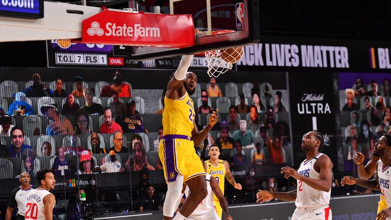 LeBron James #23 of the Los Angeles Lakers dunks the ball against the LA Clippers on July 30, 2020 at The Arena at ESPN Wide World Of Sports Complex in Orlando, Florida. 