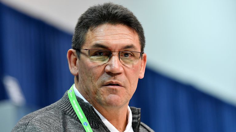 Ron Rivera says he will stand for the anthem to 'honour' family members who served in the military