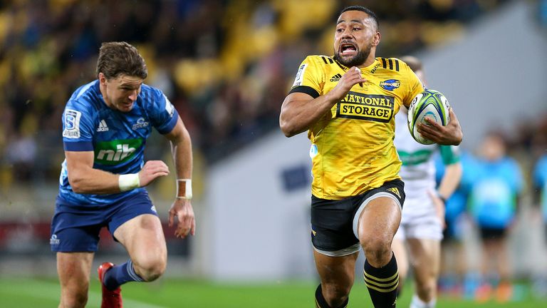 Ngani Laumape on his way to score for the Hurricanes against the Blues.