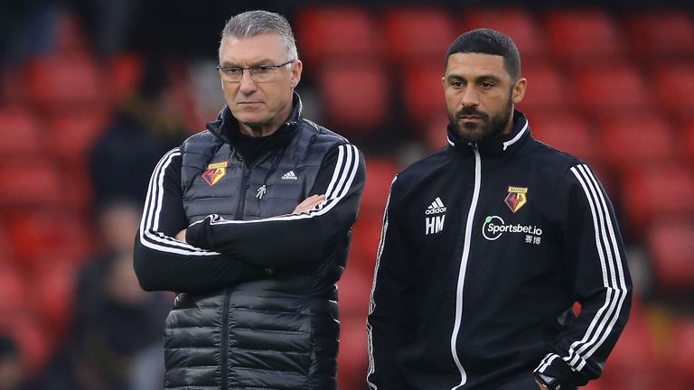 Nigel Pearson, Manager of Watford FC and assistant coach Hayden Mullins look on prior to the Premier League match between Watford FC and Wolverhampton Wanderers at Vicarage Road on January 01, 2020 in Watford, United Kingdom.