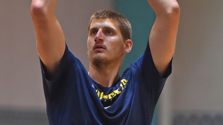 Nikola Jokic lofts a free throw at Nuggets practice in Orlando