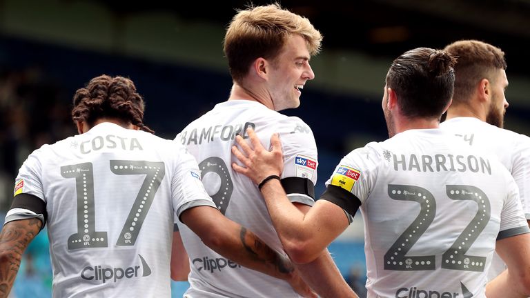 Leeds United's Patrick Bamford (centre) and his team-mates celebrate their side's first goal of the game which was an own goal scored by Barnsley's Michael Sollbauer 