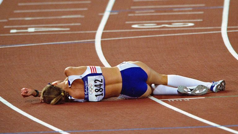 Paula Radcliffe of Great Britain lies exhausted after her courageous fourth place finish in the Womens 10,000m Final at the Olympic Stadium
