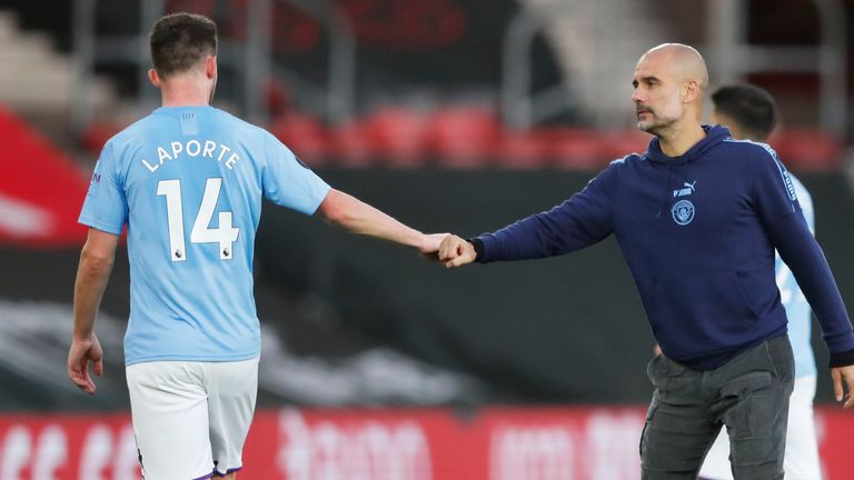 Aymeric Laporte and Guardiola shake hands after a ninth league defeat