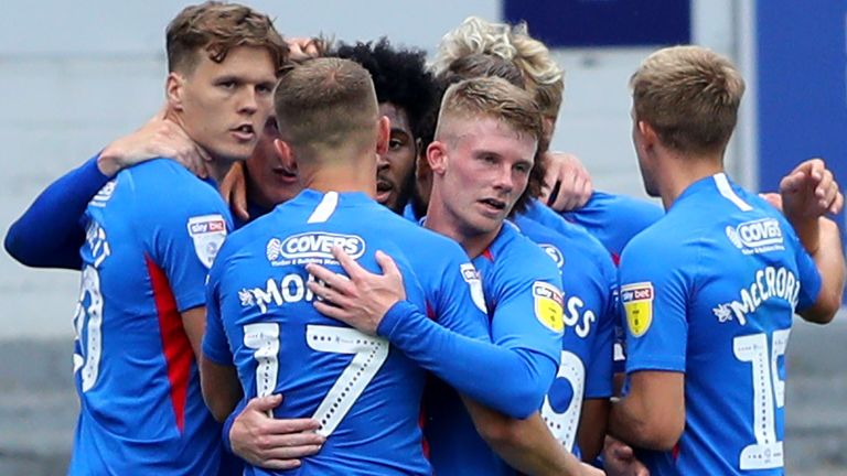 Portsmouth players celebrate after Ronan Curtis' opening goal