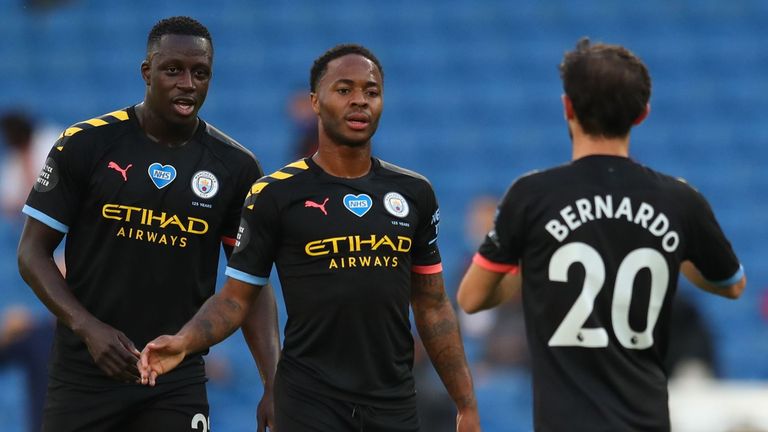 Raheem Sterling celebrates after opening the scoring for Manchester City at Brighton