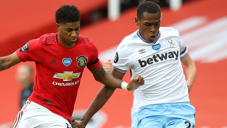 Marcus Rashford tussles with Issa Diop