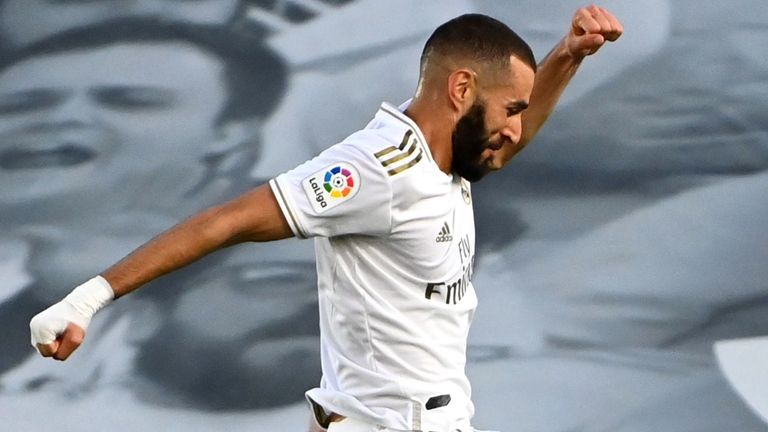 Real Madrid's French forward Karim Benzema celebrates after scoring during the Spanish League football match between Real Madrid CF and Villarreal 