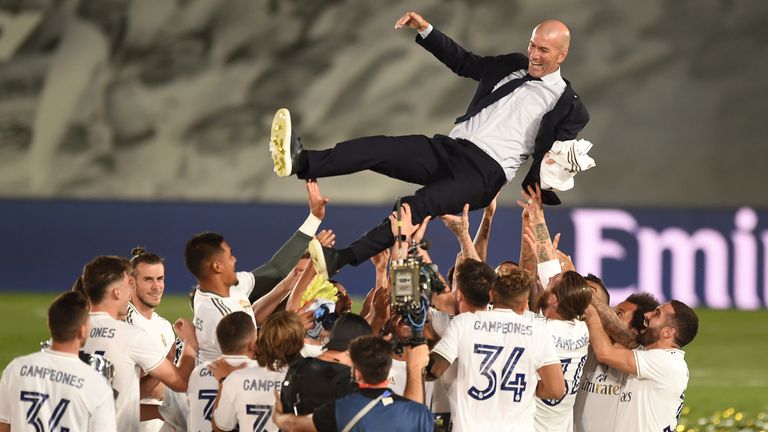 Real Madrid head coach Zinedine Zidane is thrown up in the air by his players after Madrid secure the La Liga title 