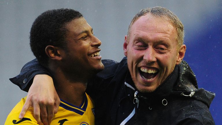 Rhian Brewster celebrates with Steve Cooper after the full time whistle at St Andrew's