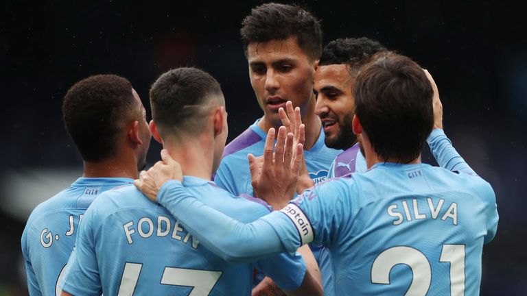 MANCHESTER, ENGLAND - JULY 08: Riyad Mahrez of Manchester City celebrates with his team after he scores his teams second goal during the Premier League match between Manchester City and Newcastle United at Etihad Stadium on July 08, 2020 in Manchester, England. 