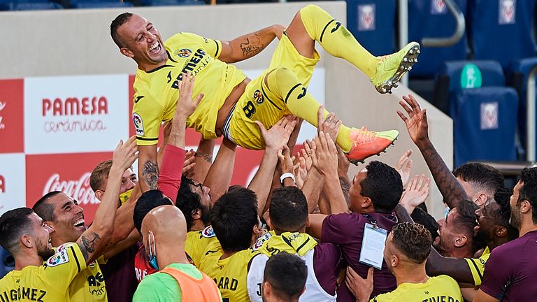 Santi Cazorla of Villarreal CF is thrown in the air by teammates after the La Liga at Estadio de la Ceramica on July 19, 2020 in Villareal, Spain. Football Stadiums around Europe remain empty due to the Coronavirus Pandemic as Government social distancing laws prohibit fans inside venues resulting in all fixtures being played behind closed doors.