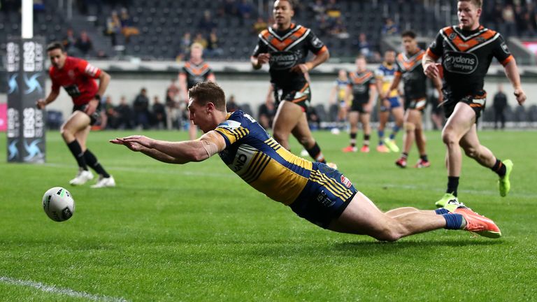 Shaun Lane dives to score for the Eels