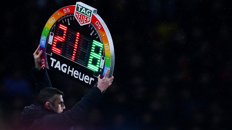 Michael Oliver holds up the Rainbow laces, this is everyones game substitutes board during the Premier League match between Watford FC and Manchester City at Vicarage Road on December 4, 2018 in Watford, United Kingdom. 