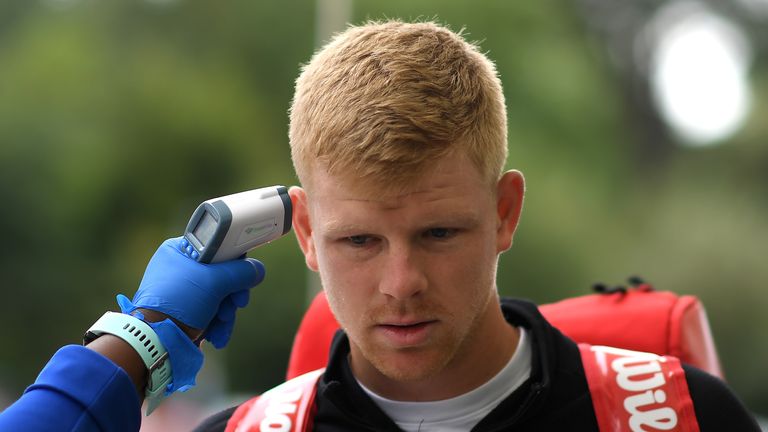 Kyle Edmund having his temperature checked ahead of entering the National Tennis CEntre