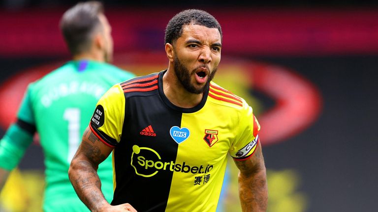 Troy Deeney celebrates hauling Watford level from the spot after 52 minutes