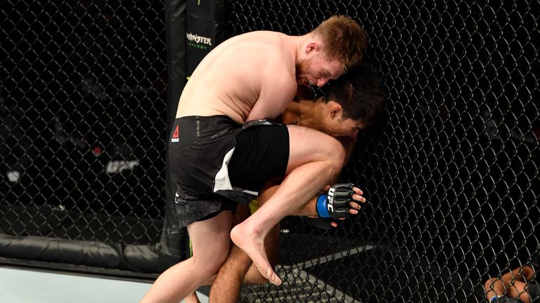 Jack Shore knees Aaron Phillips in their bantamweight fight  on UFC's 'Fight Island'